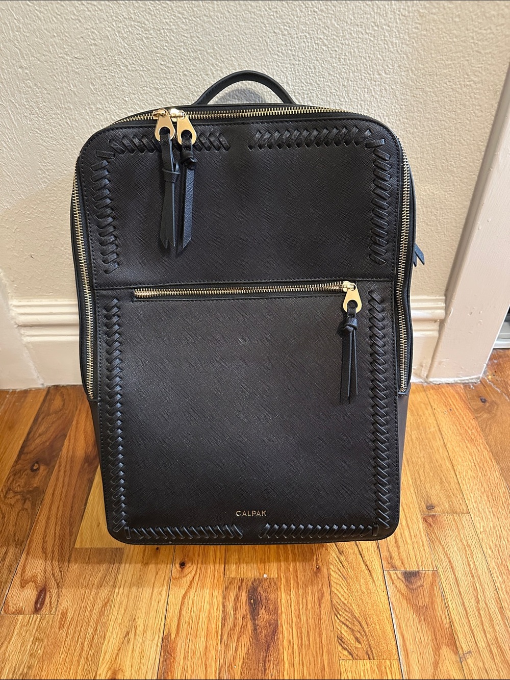 Calpak Black Backpack with Gold Hardware and Whipstitch Detail